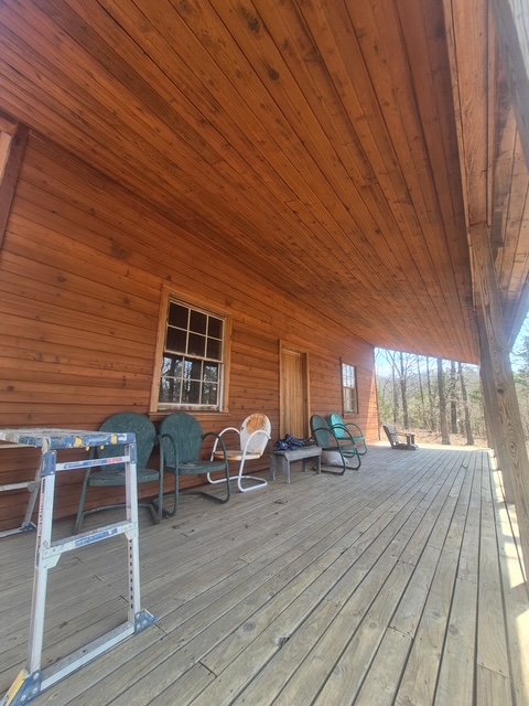 Restored cabin porch, ceiling, and decking