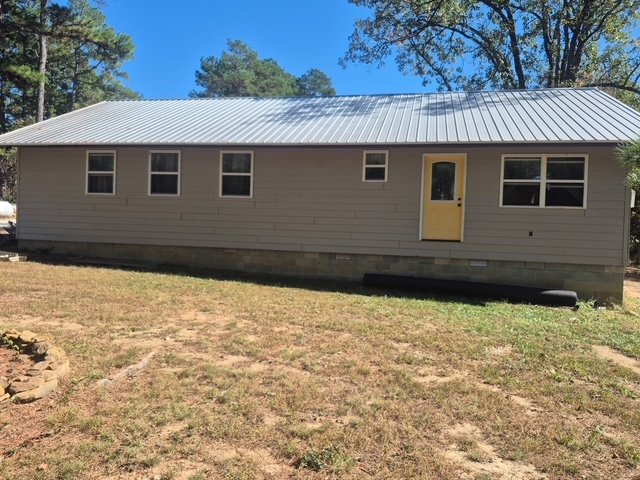 Exterior siding repaint with metal roof