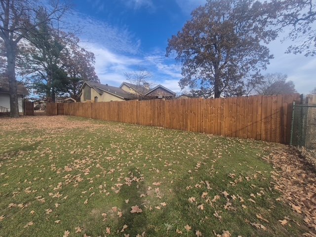 Freshly stained privacy fence